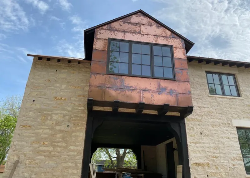 Copper metal panel facade on a stone building for Metal Roof Coating in Saugus